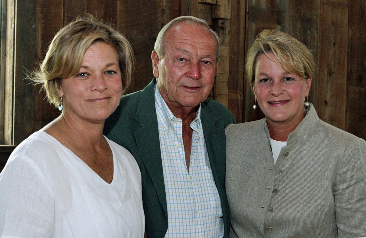 FILE - Arnold Palmer, center, is seen with his daughters, Peggy Palmer, left, of Durham, N.C., and Amy Saunders, of Orlando, Fla., inside the barn of the Winnie Palmer Nature Reserve, in Latrobe, Pa., ...