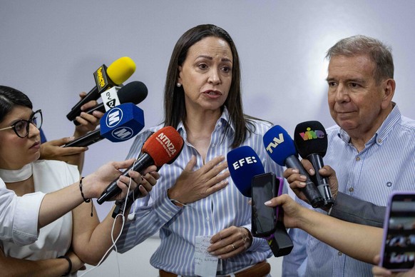 epa11413455 Former deputy Maria Corina Machado speaks during a press conference in Caracas, Venezuela, 15 June 2024. The Vente Venezuela (VV) party, led by opposition member María Corina Machado, deno ...
