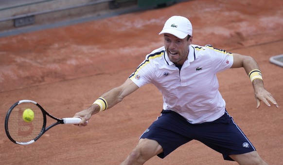 Spain&#039;s Roberto Bautista Agut plays a return to Switzerland&#039;s Henri Laakosonen during their second round match on day four of the French Open tennis tournament at Roland Garros in Paris, Fra ...