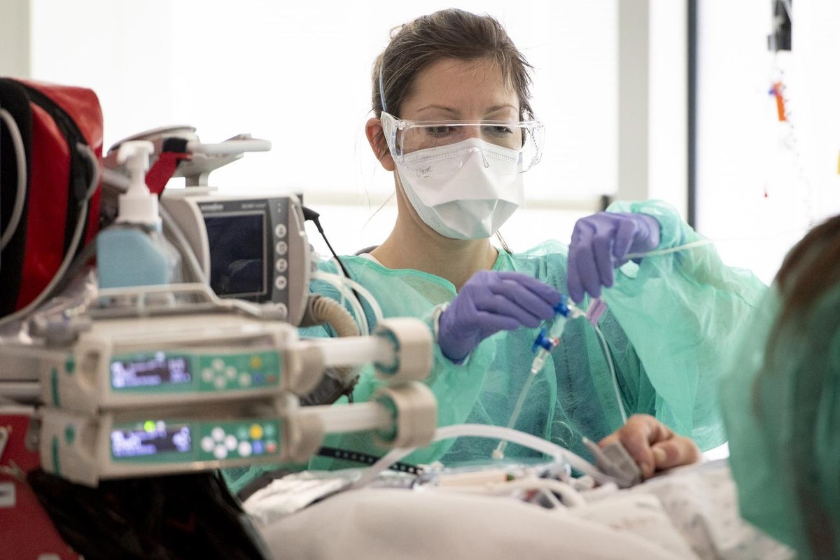 Medical worker treats a patient with COVID-19 in the intensive care unit at the HRC Hospital (Hopital Riviera-Chablais Vaud-Valais) during the state of emergency of the coronavirus disease (COVID-19)  ...