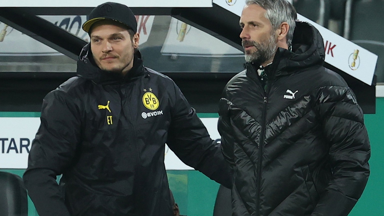 epa09047074 Edin Terzic (L), Head Coach of Borussia Dortmund (L) and Marco Rose, Head Coach of Borussia Monchengladbach interact during the German DFB Cup quarter final match between Borussia Moenchen ...