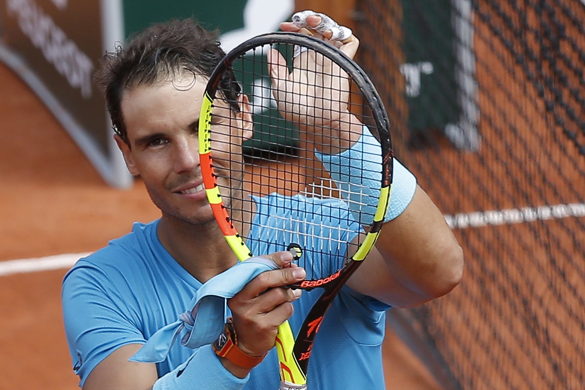 Spain's Rafael Nadal celebrates after winning his first round match of the French Open tennis tournament against Italy's Simone Bolelli at the Roland Garros stadium in Paris, France, Tuesday ...