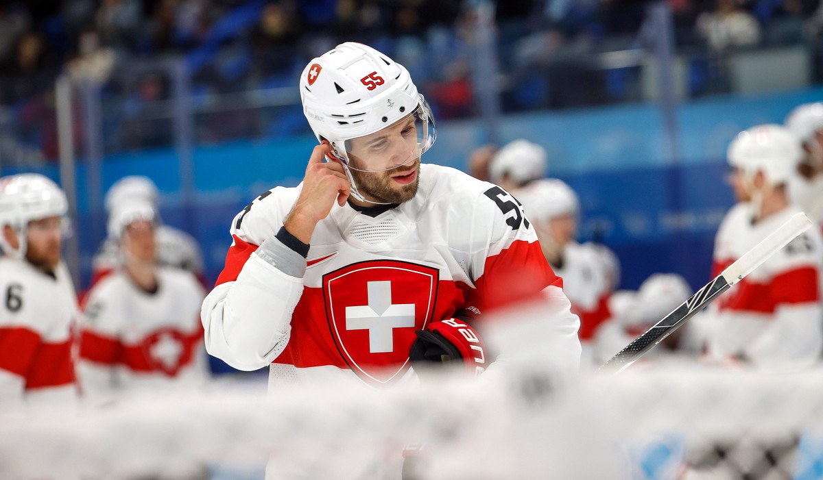 epa09740764 Romain Loeffel of Switzerland reacts after losing the Men's Ice Hockey preliminary round match between Russia and Switzerland at the Beijing 2022 Olympic Games in Beijing, China, 09 F ...