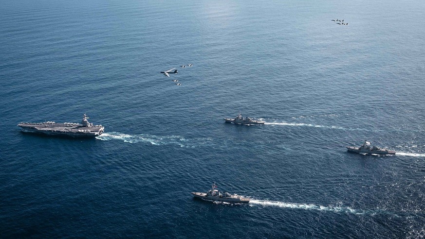 November 13, 2025, Caribbean Sea, International Waters: Aerial view of the U.S Navy Ford-class aircraft carrier USS Gerald R. Ford leading a formation of guided missile destroyers as a U.S Air Force B ...