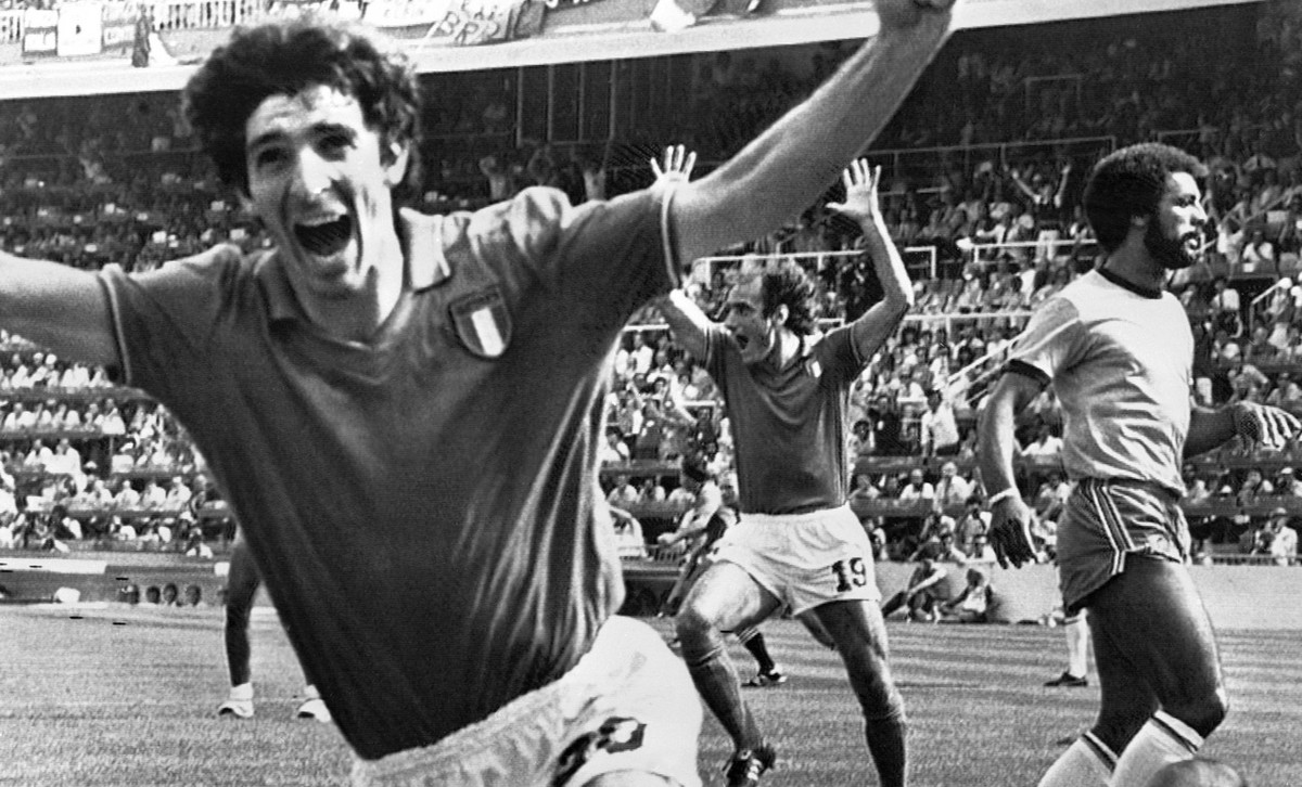 FILE - In this July 5, 1982 file photo, Italy's Paolo Rossi, left, celebrates, after scoring the second goal for his team during their World Cup match second round soccer match against Brazil, in ...