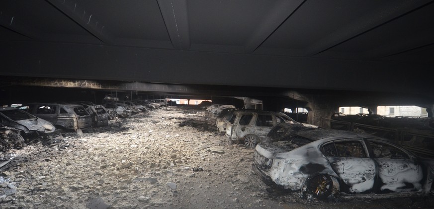epa06412860 A handout photo made available by Britain&#039;s Merseyside Fire and Rescue showing burnt out vehiclesd fire at Liverpool Echo Arena car park, in Liverpool, north west England, 01 January  ...