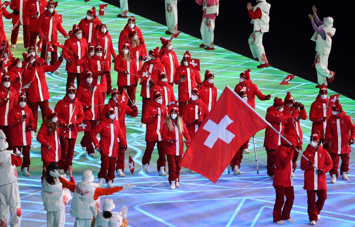 epa09727387 Athletes of Switzerland arrive for the Opening Ceremony of the Beijing 2022 Olympic Games at the National Stadium, also known as Bird's Nest, in Beijing China, 04 February 2022. EPA/J ...