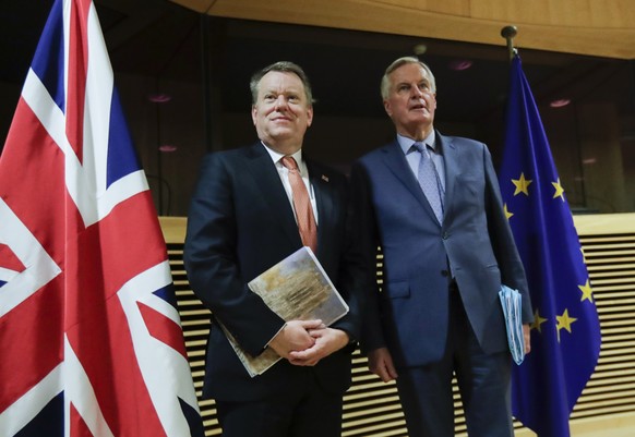 FILE - In this Monday, March 2, 2020 file photo, European Union chief Brexit negotiator Michel Barnier, right, speaks with the British Prime Minister&#039;s Europe adviser David Frost during Brexit tr ...