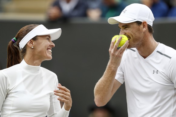 Martina Hingis of Switzerland, left, and Jamie Murray of Great Britain during their mixed doubles match against Roman Jebavy and Lucie Hradecka of Czech Republic, during the Wimbledon Championships at ...