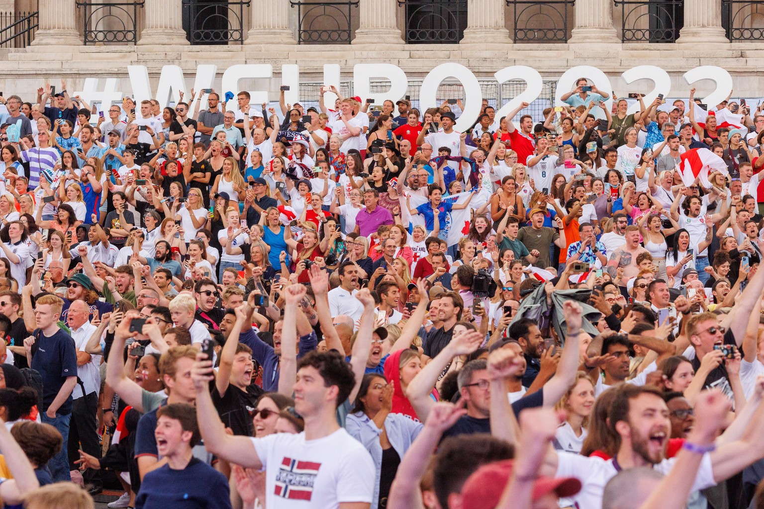 epa10100671 England fans celebrate England?s victory at full time while watching the screening of the UEFA Women&#039;s EURO 2022 final between England and Germany in Trafalgar Square, London 31 July  ...