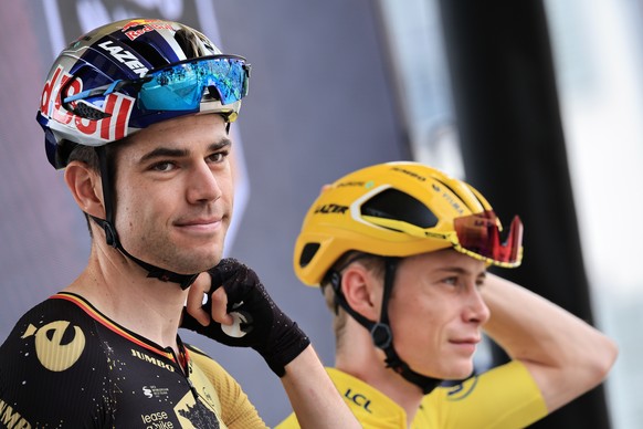 epa10741160 Belgian rider Wout van Aert (L) and Danish rider Jonas Vingegaard of team Jumbo-Visma at the start of the 11th stage of the Tour de France 2023, a 180 km race from Clermont-Ferrand to Moul ...