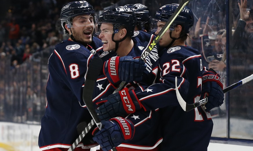 Columbus Blue Jackets&#039; Gregory Hofmann, center, celebrates his goal against the Dallas Stars during the second period of an NHL hockey game Monday, Oct. 25, 2021, in Columbus, Ohio. (AP Photo/Jay ...