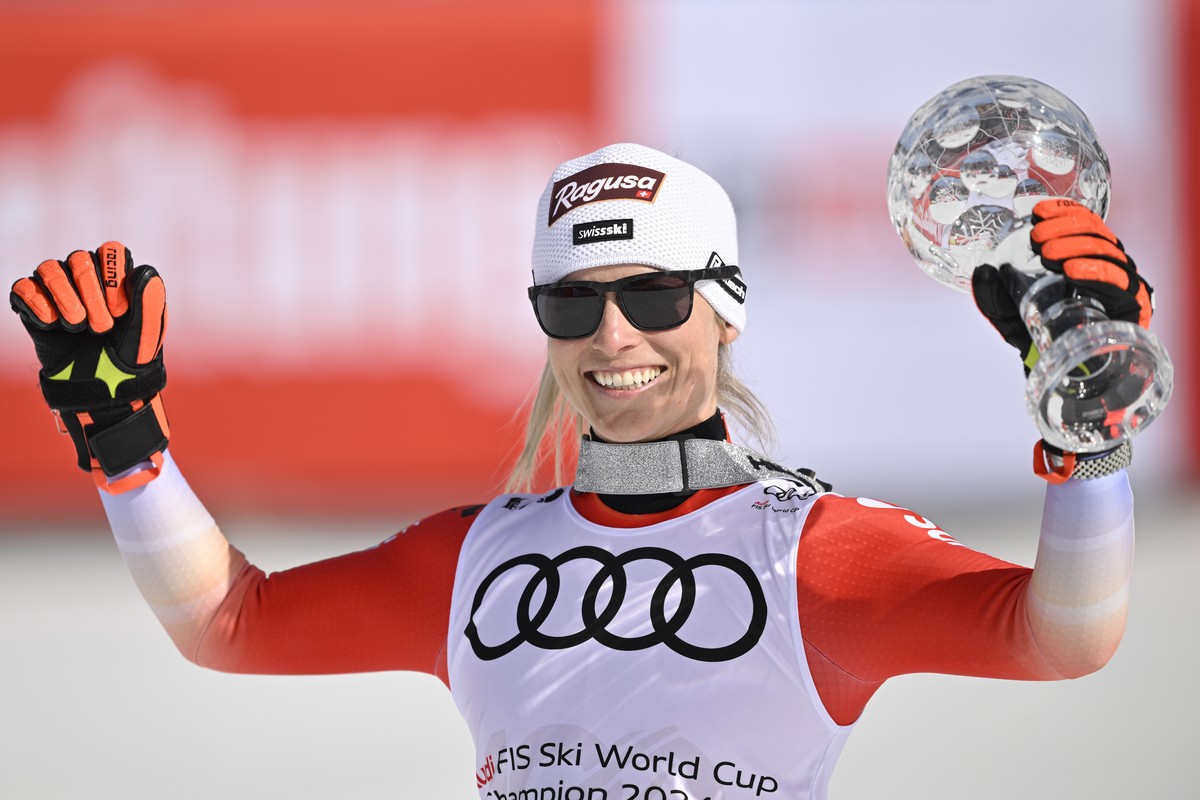 Lara Gut-Behrami of Switzerland celebrates with the women's slalom overall leader crystal globe trophy in the finish area during the women's giant slalom race at the FIS Alpine Skiing World  ...