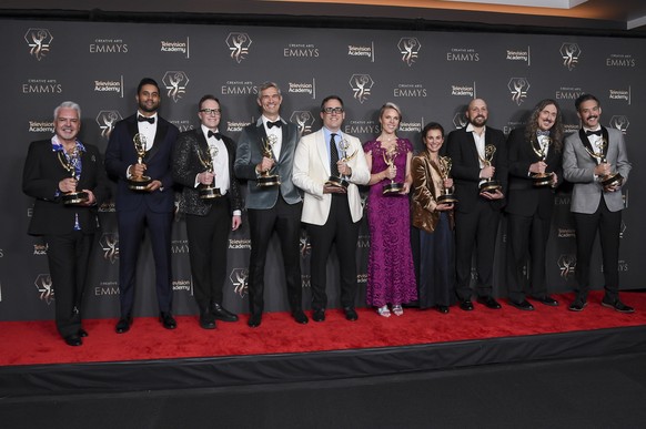 The team of "Weird: the Al Yankovic story" pose in the press room with the award for Outstanding Television Film during the evening of the Creative Arts Emmy Awards on Saturday, January 6, 202...