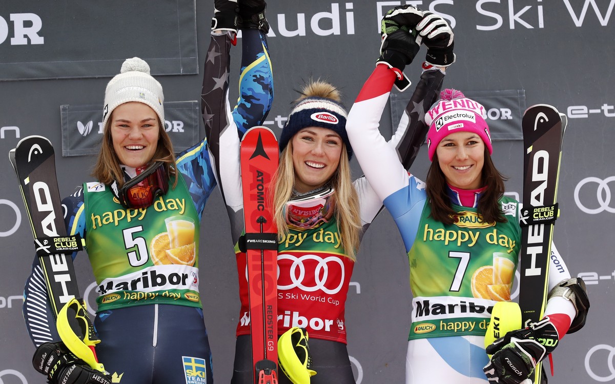 United States' Mikaela Shiffrin, center, winner of an alpine ski, women's World Cup slalom, celebrates on the podium with second-placed Sweden's Anna Swenn Larsson, left, and third-plac ...