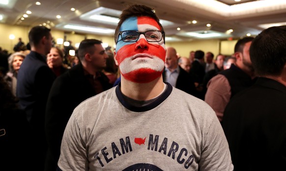 epa05152035 Michael Skocay, of Cambridge, Massachusetts, watches returns at the primary night event for Republican presidential candidate Sen. Marco Rubio at a hotel in Manchester, New Hampshire, USA, ...