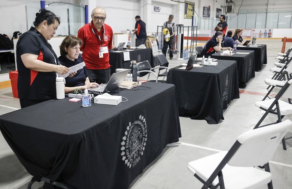 A reception center is readied for wildfire evacuees forced from Jasper National Park in Calgary, Alberta, Canada, Tuesday, July 23, 2024. (Jeff McIntosh/The Canadian Press via AP)