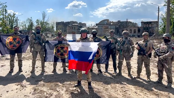 FILE - In this grab from video and released by Prigozhin Press Service on Saturday, May 20, 2023, Yevgeny Prigozhin, the head of the military company Wagner Group speaks with a Russian national…