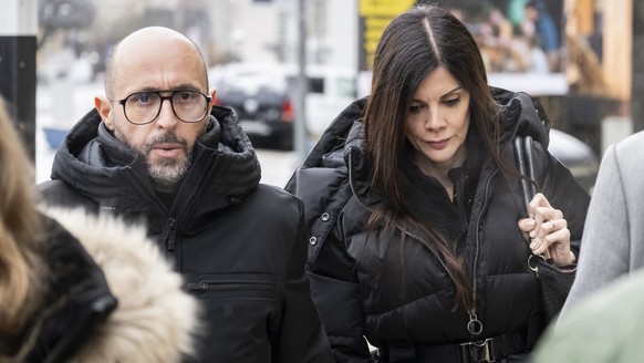 epa12726288 The owners of 'Le Constellation' bar in Crans-Montana, Jacques, (L), and Jessica Moretti of France, arrive to a hearing before the public prosecutor of the canton of Valais, foll ...