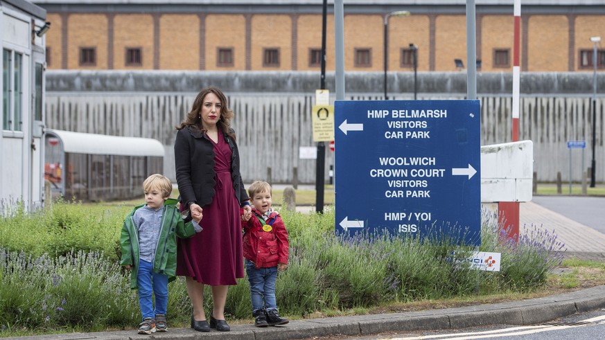 Stella Moris stands with her children Gabriel, four, left, and Max, two, outside Belmarsh Prison, following a visit to her partner and their father Julian Assange in London, Saturday June 19, 2021. As ...