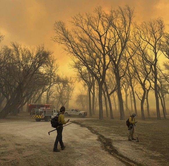 In this photo from the Flower Mound, Texas Fire Department, Flower Mound firefighters respond to a fire in the Texas Panhandle, Tuesday, February 27, 2024. A rapidly spreading wildfire in Texas...