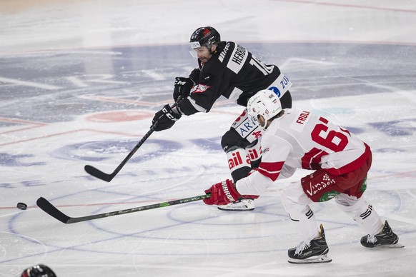 From left, Lugano&#039;s player Riccardo Werder and Lausanne&#039;s player Michael Frolik during the preliminary round game of National League Swiss Championship 2021/22 between HC Lugano against Laus ...