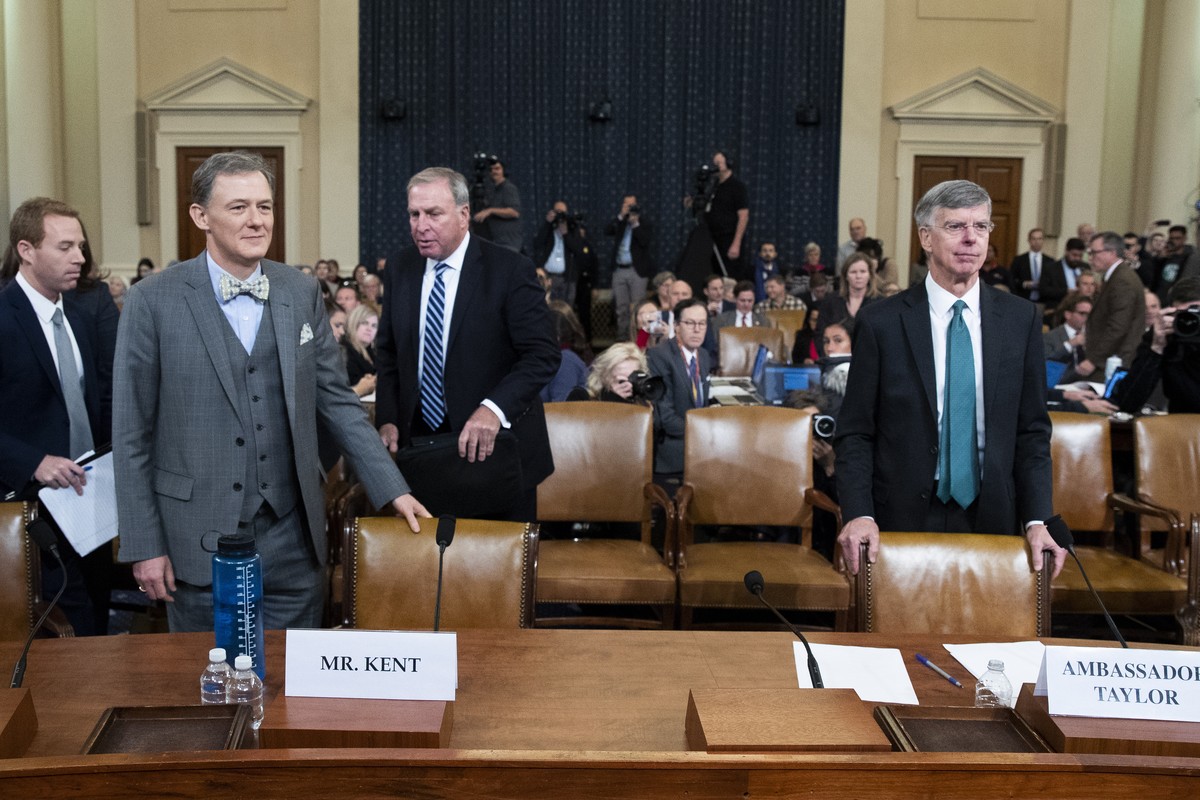 epa07993835 Charge d'Affaires at the US embassy in Ukraine Bill Taylor (R) testifies beside Deputy Assistant Secretary of State for Europe and Eurasia George Kent (L) return from a break during t ...