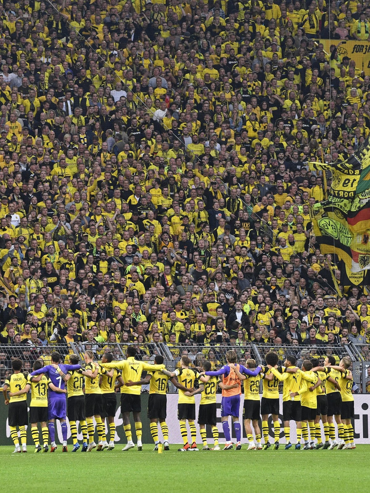 Dortmund's players celebrate with their fans after winning the German Bundesliga soccer match between Borussia Dortmund and RB Leipzig in Dortmund, Germany, Sunday, Aug. 26, 2018. (AP Photo/Marti ...