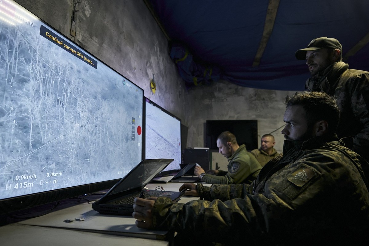 Ukrainian soldiers watch drone feeds from an underground command center in Bakhmut, Donetsk region, Ukraine, Sunday, Dec. 25, 2022. The Ukrainian government minister in charge of technology says his c ...