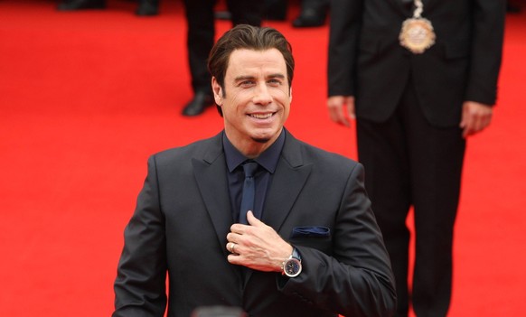 U.S. actor John Travolta arrives at the opening of the 48th Karlovy Vary International Film Festival in Karlovy Vary, Czech Republic, Friday, June 28, 2013. CTKxPhoto/PavelxNemecek CTKPhotoP2013062807 ...