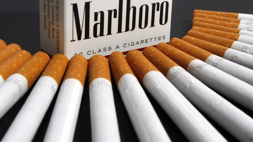 FILE - In this July 17, 2012 file photo, Marlboro cigarettes are displayed in Montpelier, Vt. Philip Morris and Altria have ended merger talks and JUULÄôs CEO is stepping down from the top post as cr ...