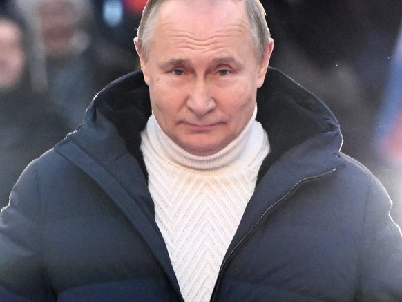 epa09833831 Russian President Vladimir Putin attends a concert marking the 8th anniversary of Crimea&#039;s reunification with Russia at the Luzhniki stadium in Moscow, Russia, 18 March 2022. Russia i ...