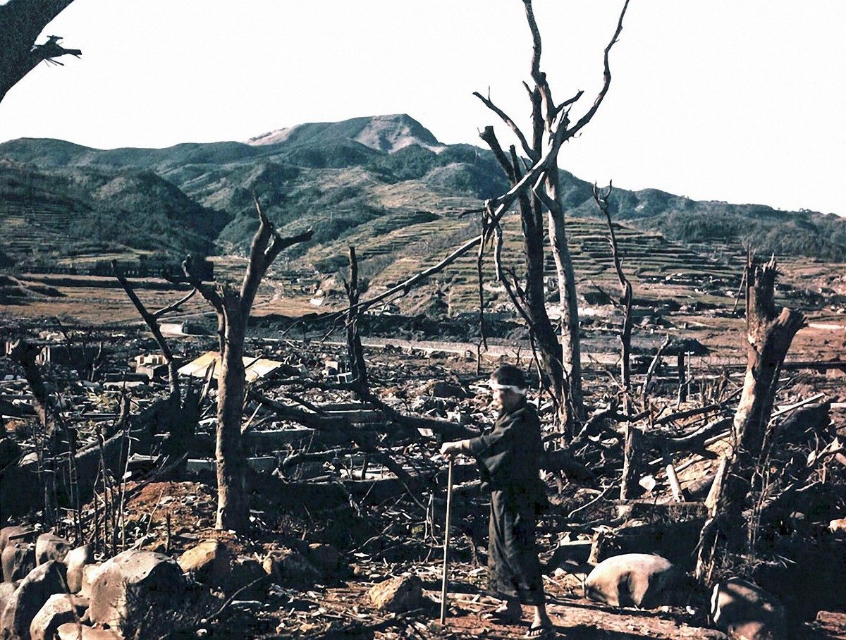 circa November 1945: Japanese radiologist, Doctor Takashi Nagai (1908 - 1951), amid the ruins of the Matsuyama district of Nagasaki after the atomic bombing of the Japanese city on 9th August 1945. (P ...