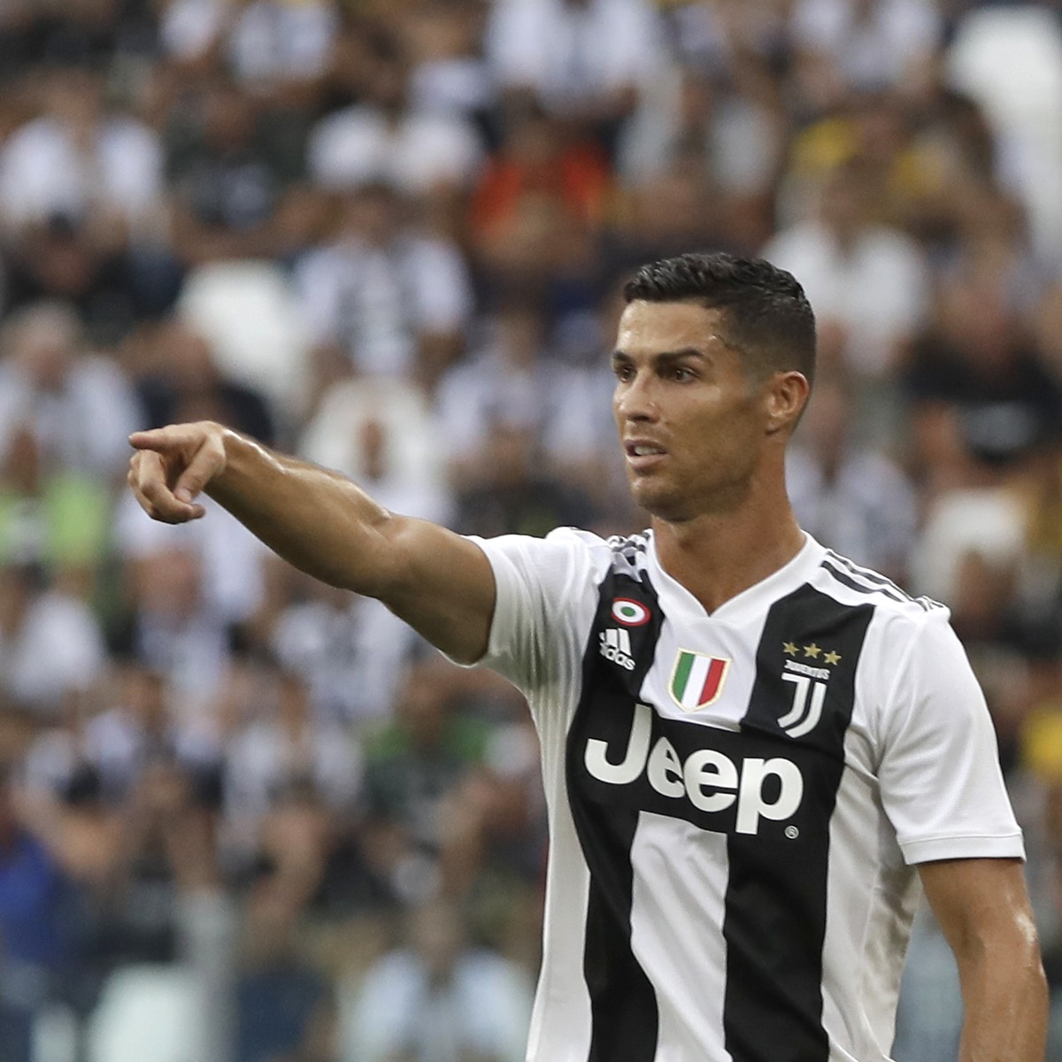 Juventus' Cristiano Ronaldo gestures to his teammates during the Serie A soccer match between Juventus and Lazio at the Allianz Stadium in Turin, Italy, Saturday, Aug. 25, 2018. (AP Photo/Luca Br ...