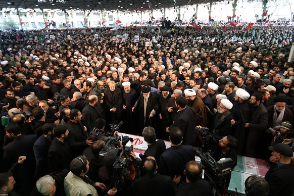 epa08107308 A handout photo made available by Iranian Supreme Leader&#039;s Office shows Iranian Supreme Leader Ayatollah Ali Khamenei (C) praying before the coffins of slain Iranian Revolutionary Gua ...