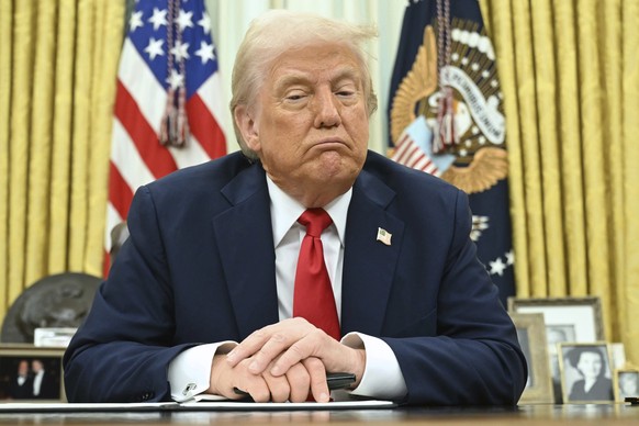 President Donald Trump speaks to reporters before signing an executive order in the Oval Office of the White House in Washington, Monday, March 31, 2025. (Pool via AP)
Trump