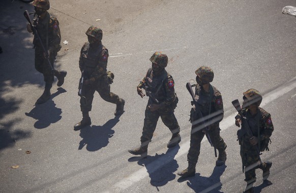 FILE - The Army moves in to disperse protesters during a demonstration in Yangon, Myanmar, Sunday, March 7, 2021. (AP Photo, File)