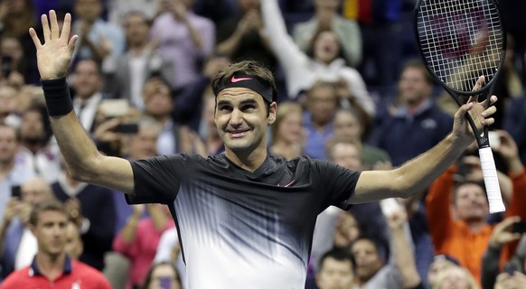 Roger Federer, of Switzerland, celebrates after defeating Frances Tiafoe, of the United States, at the U.S. Open tennis tournament, Tuesday, Aug. 29, 2017, in New York. (AP Photo/Julio Cortez)