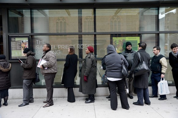 epa03612565 Jobseekers line up to meet with a prospective employer during a job fair sponsored by Jewish community organizations and synagogues, and state representatives at The Jewish Community Cente ...