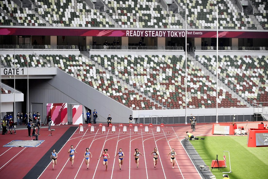 Japanese athletes compete during an athletics test event for Tokyo 2020 Olympics Games at the National Stadium, in Tokyo, Japan, Sunday, May 9, 2021. Fans will be banned from Tokyo-area stadiums and a ...