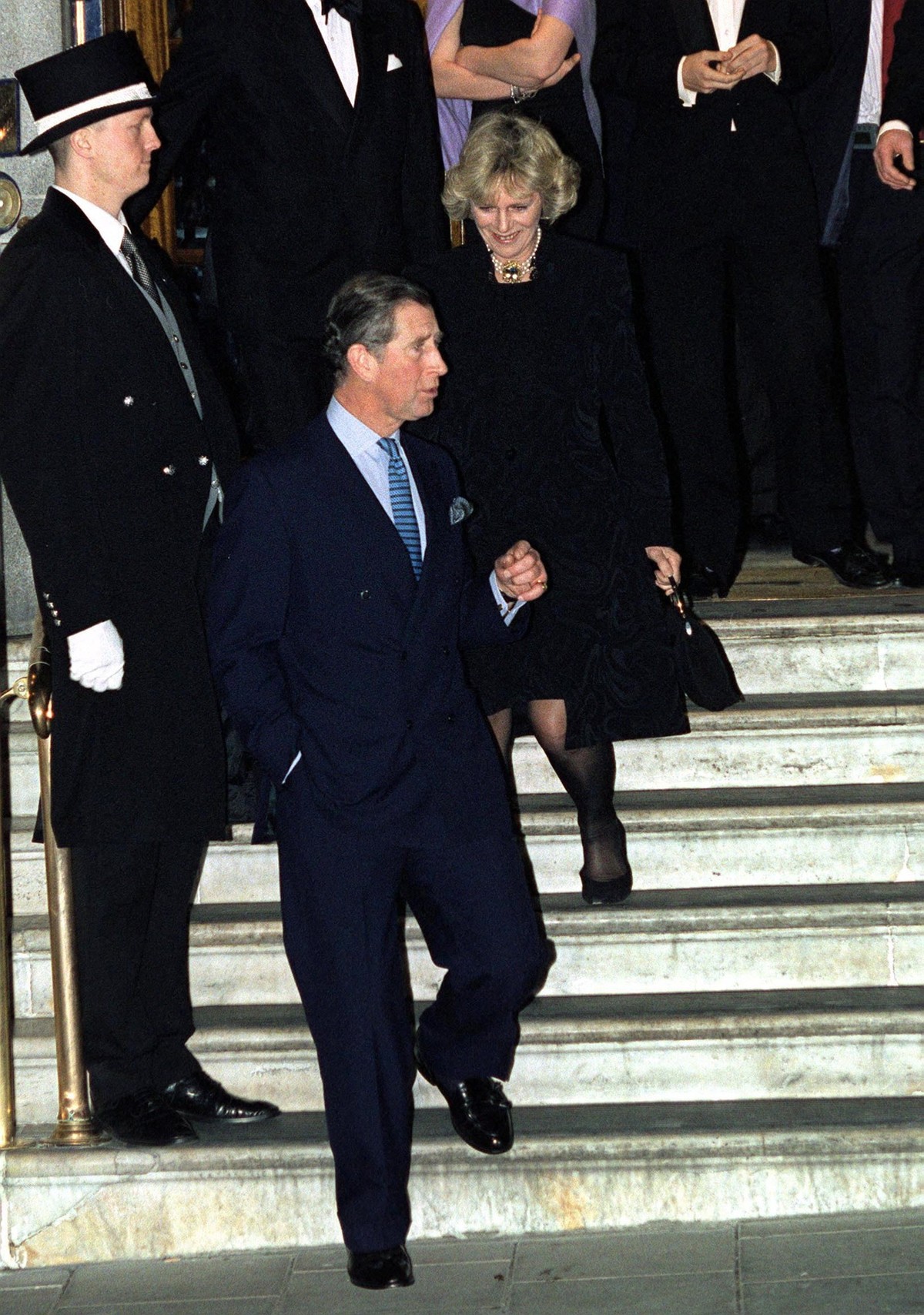 LONDON, UNITED KINGDOM - JANUARY 28: Prince Charles With Camilla Parker-bowles Walking Down The Stairs As They Leave The Ritz Hotel In London After A Birthday Party For Her Sister, Annabel. (Photo by  ...