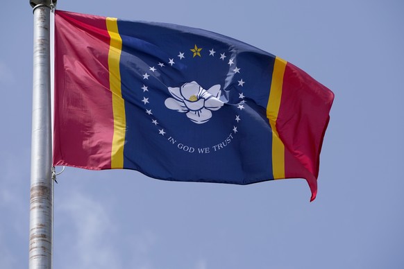 The magnolia centered banner chosen Wednesday, Sept. 2, 2020 by the Mississippi State Flag Commission flies outside the Old State Capitol Museum in downtown Jackson, Miss. The nine member committee vo ...