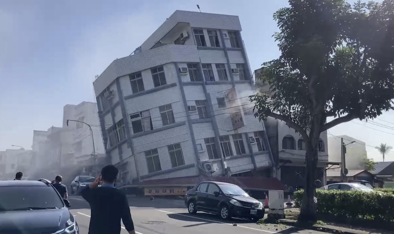 In this image taken from a video footage run by TVBS, a partially collapsed building is seen in Hualien, eastern Taiwan on Wednesday, April 3, 2024. A powerful earthquake rocked the entire island of T ...