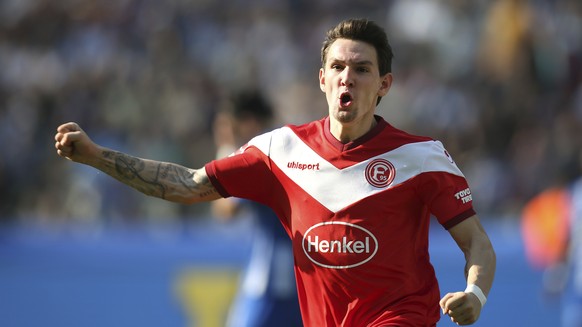 Duesseldorf's Benito Raman celebrates his goal during the Bundesliga soccer match between Hertha BSC Berlin and Fortuna Duesseldorf in Berlin, Germany, Saturday, April 6, 2019. (Andreas Gora/dpa ...