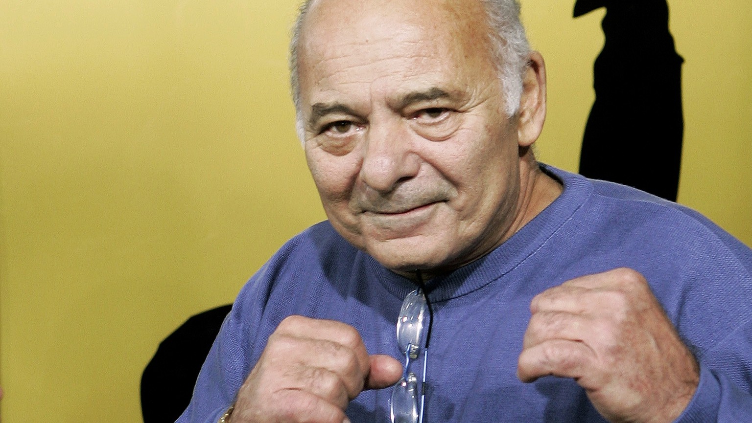 FILE - Burt Young, a cast member of the film &quot;Rocky Balboa,&quot; gestures at the premiere of the film in Los Angeles, Dec. 13, 2006. Burt Young, the Oscar-nominated actor who played Paulie, the  ...