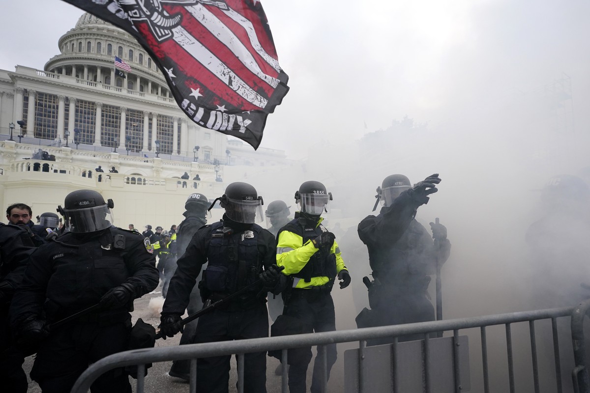 Police hold off Trump supporters who tried to break through a police barrier, Wednesday, Jan. 6, 2021, at the Capitol in Washington. As Congress prepares to affirm President-elect Joe Biden's vic ...