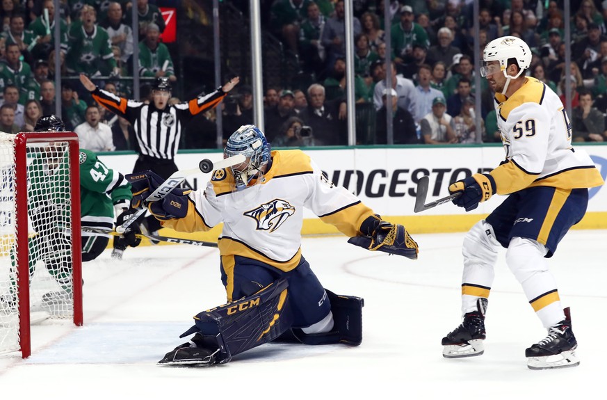 Nashville Predators goaltender Pekka Rinne (35) slaps at a Dallas Stars shot with his stick as Stars&#039; Alexander Radulov (47) and Predators&#039; Roman Josi (59) watch in the first period of Game  ...