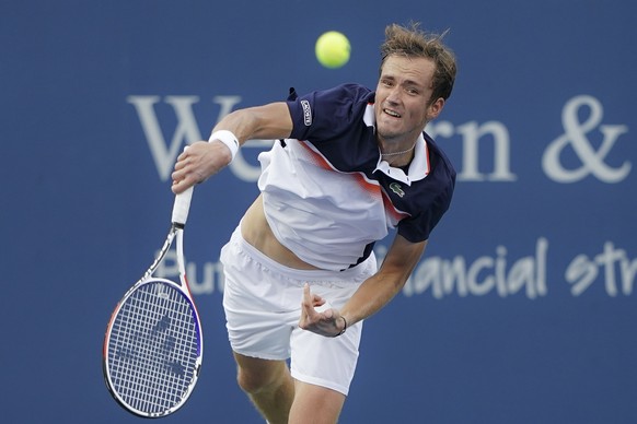 Daniil Medvedev, of Russia, serves to Novak Djokovic, of Serbia, during the Western &amp; Southern Open tennis tournament, Saturday, Aug. 17, 2019, in Mason, Ohio. (AP Photo/John Minchillo)
Daniil Med ...