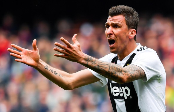 epa07444715 Juventus Croatian forward Mario Mandzukic reacts during the Italian Serie A soccer match Genoa Cfc vs Juventus Fc at Luigi Ferraris Stadium in Genoa, Italy, 17 March 2019. EPA/SIMONE ARVED ...