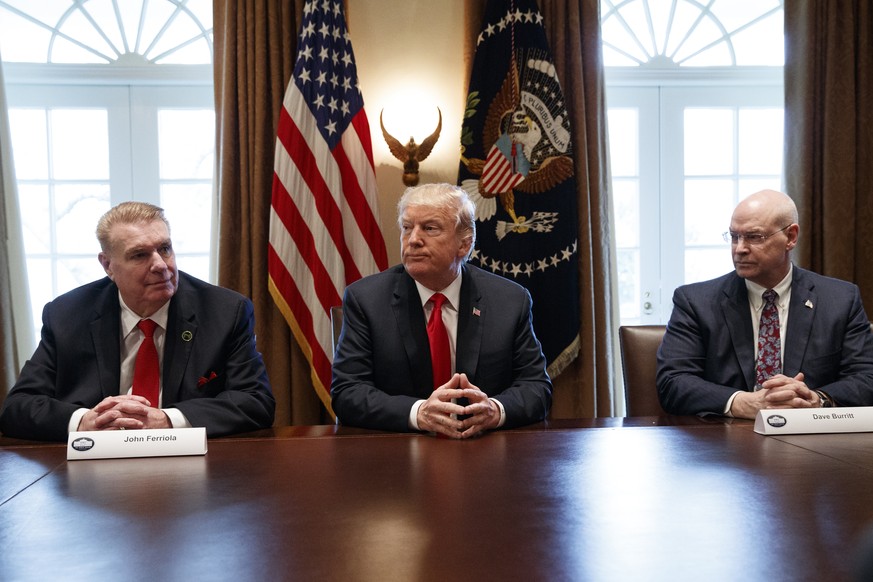 President Donald Trump pauses as he speaks during a meeting with steel and aluminum executives in the Cabinet Room of the White House, Thursday, March 1, 2018, in Washington. From left, John Ferriola  ...